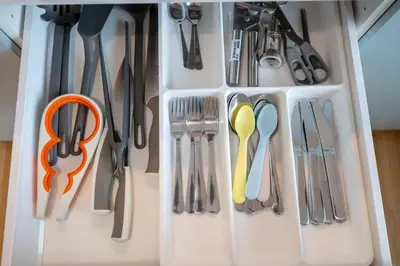 a refrigerator filled with lots of utensils at New-built Golden Luxury Studio with Balcony in Prague