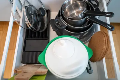 a white plate sitting on top of a stove at New-built Golden Luxury Studio with Balcony in Prague