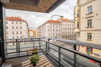 a balcony with a view of a city at New-built Golden Luxury Studio with Balcony in Prague