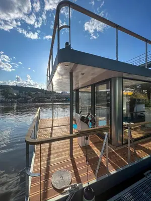 a wooden deck of a boat in the water at Prague Stream in Prague