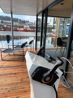 a gym on a boat with a view of the water at Prague Stream in Prague