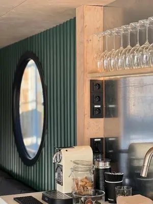 a kitchen with a counter with a toaster and a mirror at Prague Stream in Prague