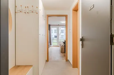 a hallway with a door leading into a room at Garden Studio near Metro Kolbenova in Prague
