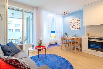 a living room with a couch and a table at Colorful Apartment - Balcony, Free Parking, by Gravity Prague in Prague