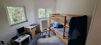 a bedroom with a bunk bed and a desk with a computer at BohniceDrahanVltavaRelax in Zdiby