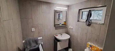 a small bathroom with a sink and a mirror at BohniceDrahanVltavaRelax in Zdiby