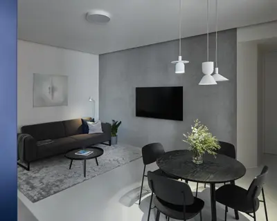 a living room with a couch and a table and chairs at Grace Apartment by Prague Castle in Prague