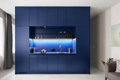 a kitchen with blue cabinets and a sink at Grace Apartment by Prague Castle in Prague