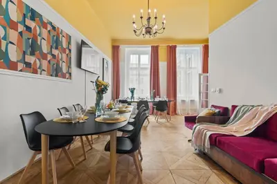 a living room with a table and a couch at Vintage APTs in Heart of Prague by Michal&Friends in Prague