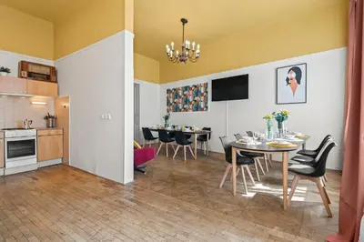 a kitchen and dining room with a table and chairs at Vintage APTs in Heart of Prague by Michal&Friends in Prague