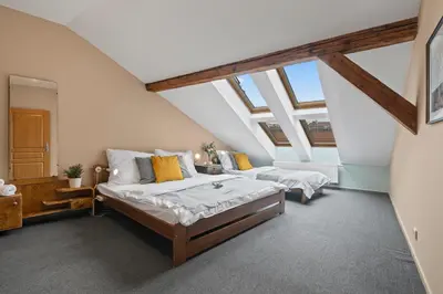 a bedroom with two beds in a attic at Vintage APTs in Heart of Prague by Michal&Friends in Prague