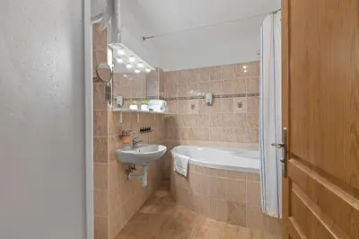 a bathroom with a sink and a bath tub at Vintage APTs in Heart of Prague by Michal&Friends in Prague