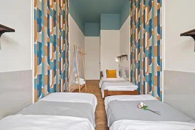 a hospital room with three beds with flowers on them at Vintage APTs in Heart of Prague by Michal&Friends in Prague