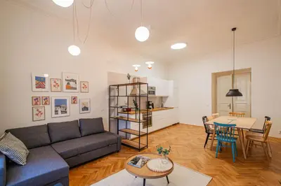 a living room with a couch and a table at 3BDR main square spacious designed apartment in Prague