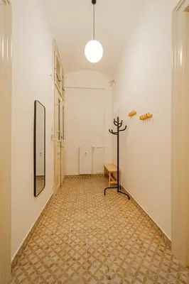 an empty hallway with a cross on the wall at 3BDR main square spacious designed apartment in Prague
