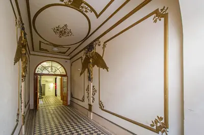 an empty hallway with a ceiling and tiled floors at 3BDR main square spacious designed apartment in Prague