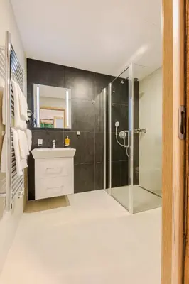 a bathroom with a shower and a sink at Hotel Tříška in Brandýs nad Labem