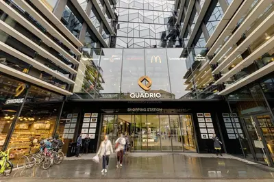 a shopping mall with people walking in front of it at Deluxe suite in prime location in Prague