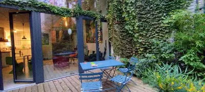 a blue table and chairs on a patio at Romantic and atypical apartments in Prague's Montmartre in Prague