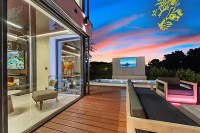 a house with a view of the sunset at Chandelier Sky Mansion in Tuchoměřice