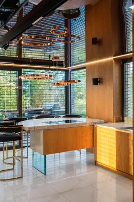 a lobby with a bar with chairs and windows at Chandelier Sky Mansion in Tuchoměřice
