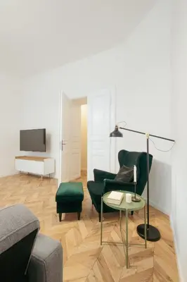 a living room with a couch and a table at Prague Days - Spacious Apartment with Balcony near Wenceslas Square in Prague