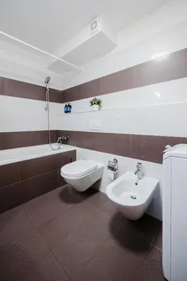 a bathroom with a toilet and a sink at Prague Days - Studio with Workspace by TV Tower in Žižkov in Prague