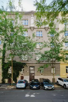 three cars parked in front of a building at Prague Days - Studio with Workspace by TV Tower in Žižkov in Prague