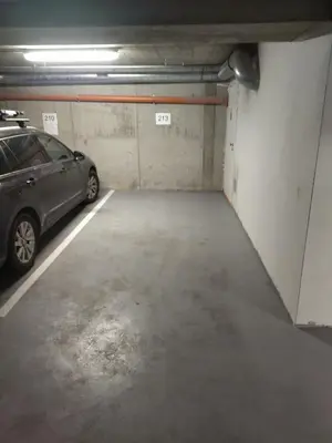 a parking garage with a car parked in it at Brand new studio apartment #24 in Elite residence with free secure parking in the center in Prague