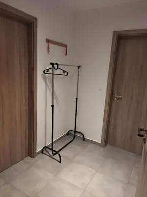 a room with a black stand in front of a door at Brand new studio apartment #24 in Elite residence with free secure parking in the center in Prague