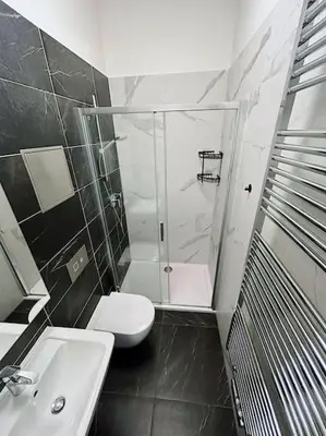 a bathroom with a shower and a toilet and a sink at Apt near Muzeum Prague 1 in Prague