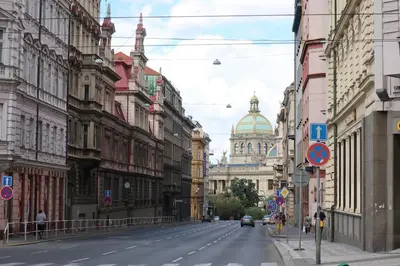 an empty city street with a building in the distance at Apt near Muzeum Prague 1 in Prague