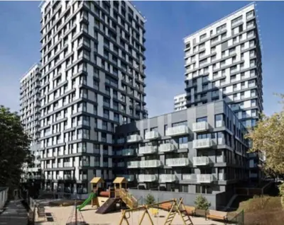 two tall buildings with a playground in front of them at Residence Garden Tower - Parking in Prague