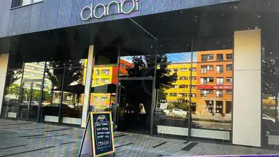 a amazon store front with a sign in front of it at Residence Garden Tower - Parking in Prague