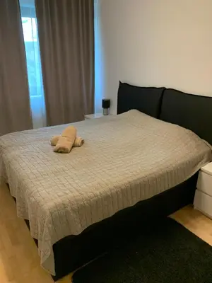 a bed with a stuffed animal on top of it at Residence Garden Tower - Parking in Prague