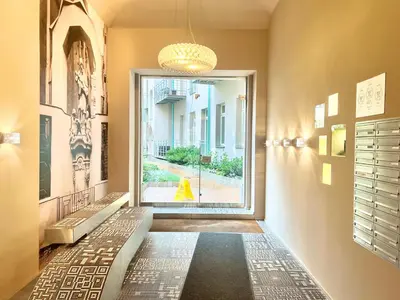 a hallway with a door leading to a street at exclusive apartment centrum Prague in Prague
