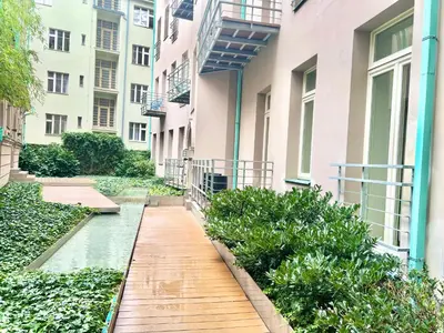 a walkway in a courtyard of a building at exclusive apartment centrum Prague in Prague