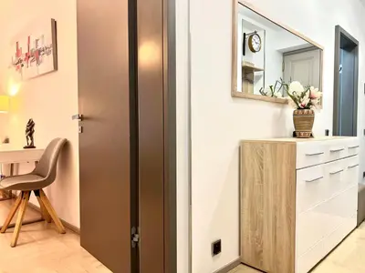a door in a room with a desk and a mirror at exclusive apartment centrum Prague in Prague
