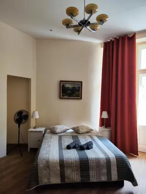 a bedroom with a bed with two bow ties on it at Stella apartments in Prague
