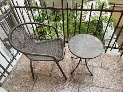 a table and a chair sitting next to a table at Stella apartments in Prague