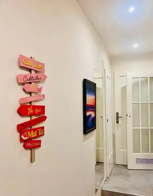 a bunch of signs hanging on a wall in a room at Modern apartment Na Hluboké in Prague in Prague