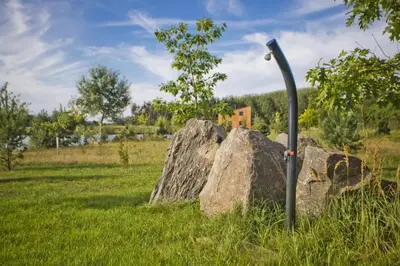 a couple of large rocks in a field at RESORT SALIXA u Poděbrad in Poděbrady