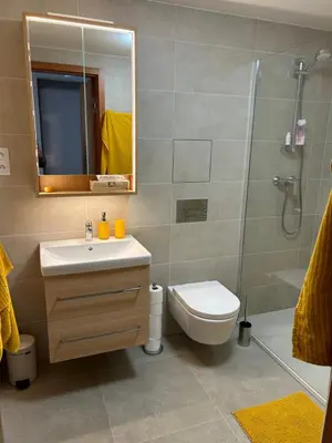 a bathroom with a sink toilet and a shower at Prague Smíchov Anděl Apartment in Prague