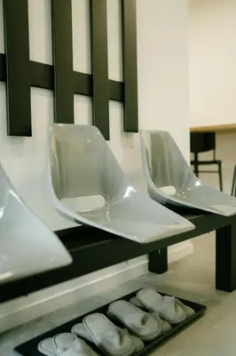 two white toilets on a shelf with donuts at Godiland Apartment in Prague