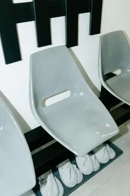 a bathroom with a toilet and two mirrors at Godiland Apartment in Prague