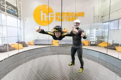 two people are standing on a trampoline at Apartmán u METRA, 4 hosté, parking free, blízko O2 arena in Prague