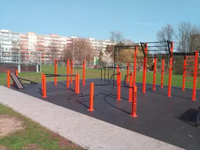 an empty playground with orange poles and swings at Apartmán u METRA, 4 hosté, parking free, blízko O2 arena in Prague