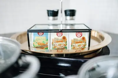 a container of food on a plate on a counter at Royal Heritage Apartments - City Centre in Prague