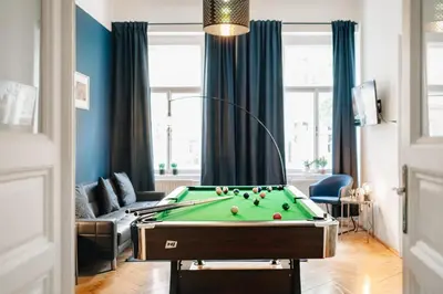 a living room with a pool table at Royal Heritage Apartments - City Centre in Prague