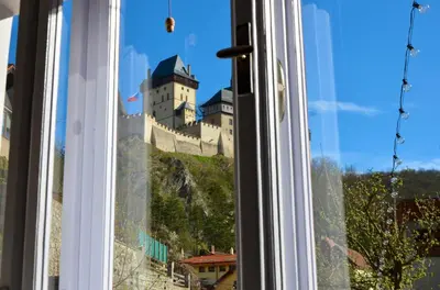 a window with a view of a castle at Karlštejn 34 in Karlštejn